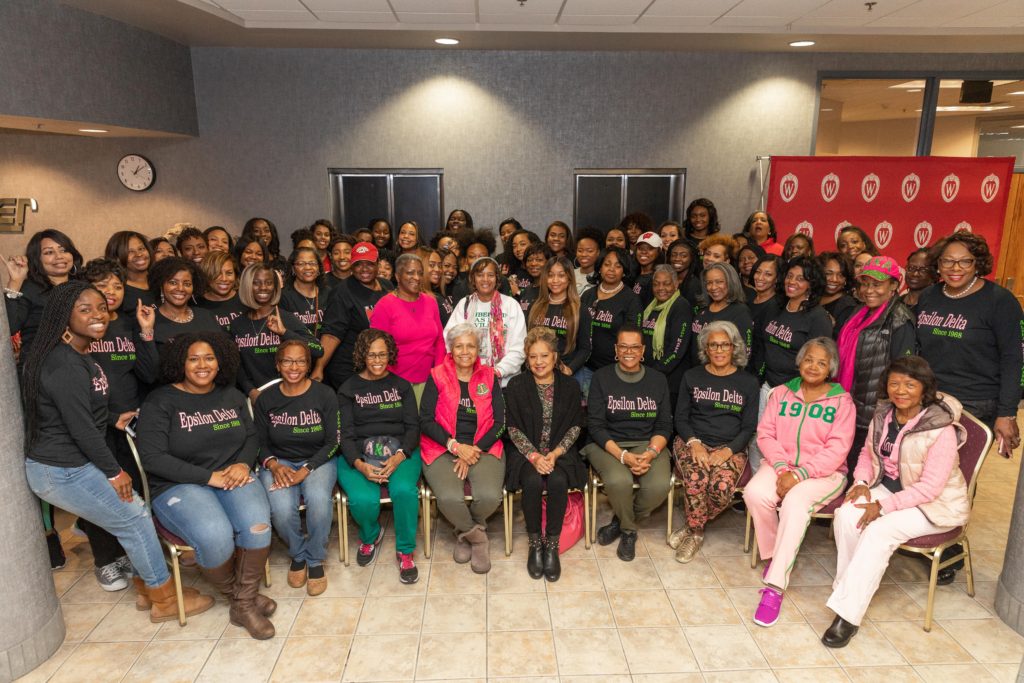 Dozens of women stand and sit in a posed portrait for the Epsilon Delta chapter of the Alpha Kappa Alpha sorority.