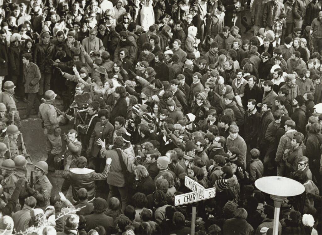 A crowd of strikers, police and onlookers gather near the corner of Linden and Charter during the Black Student Strike of 1969. UW-MADISON ARCHIVES