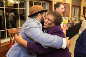 Gloria Hawkins, assistant vice provost and director of the Mercile J. Lee Scholars Program, receives a hug from Gabriel Stulman ('03), New York restauranteur and entrepreneur, at a Multicultural Homecoming event on Oct. 18, 2018, in Camp Randall Stadium.