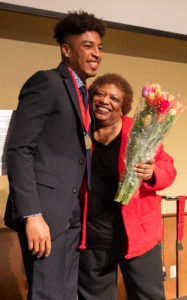 Gloria Hawkins congratulates 2019 Chancellor Scholar Maurice Lucre. Photo by Amadou Kromah.