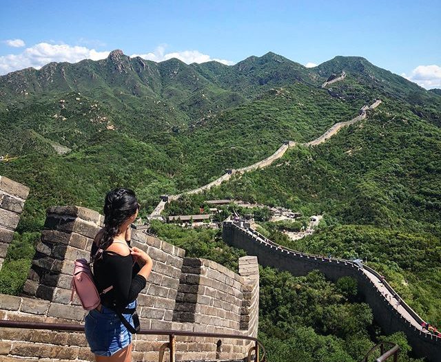 World History lies at Cathy Trans' feet as she overlooks the Great Wall of China.