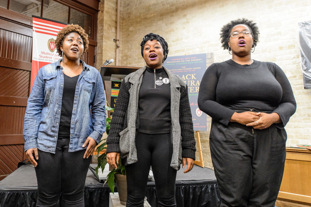 Nikeya Bramlett, Deja Mason and Bobbie Briggs, members of the University Gospel Choir, perform before a crowd of more than 100 at the new Black Cultural Center. PHOTO: BRYCE RICHTER