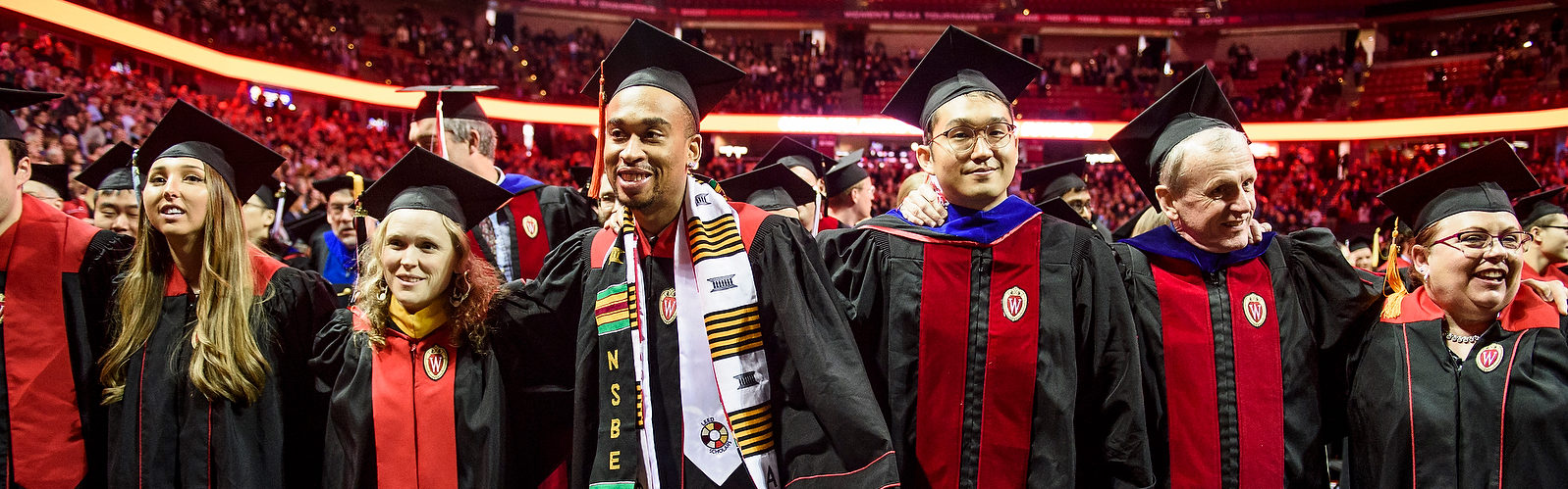 Graduates take part in the singing of Varsity during the winter commencement ceremony held in the Kohl Center at the University of Wisconsin-Madison on Dec. 16, 2018. (Photo by Bryce Richter /UW-Madison)