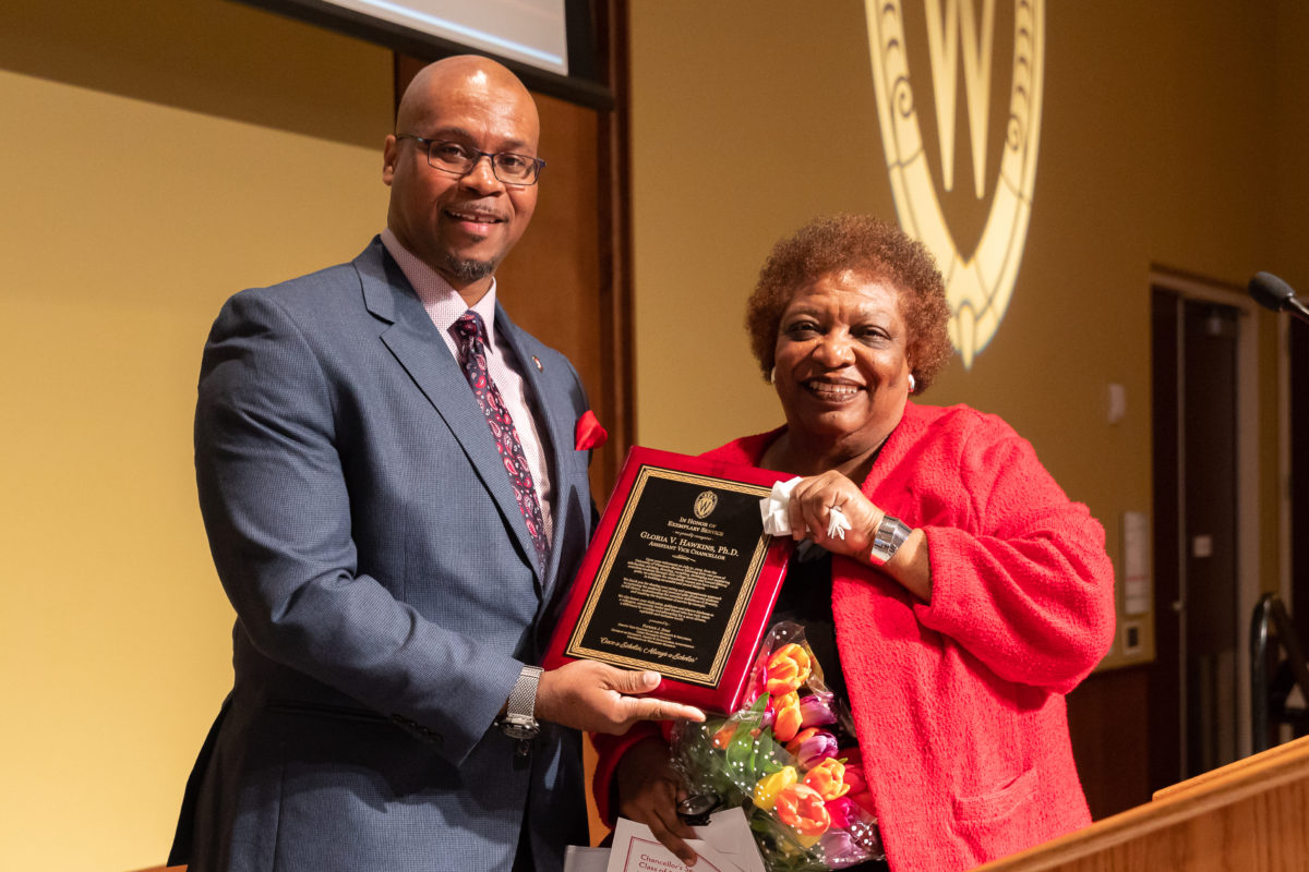 Dr. Gloria Hawkins receives a plaque honoring her 41 years on the UW-Madison campus from Patrick J.SIms, Deputy Vice Chancellor for Diversity & Inclusion. Photo by Amadou Kromah.