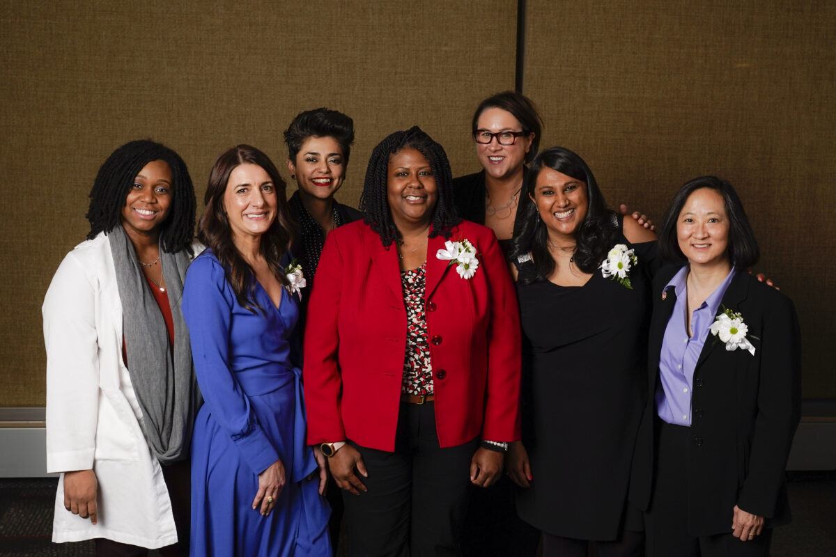 Seven Outstanding Women of Color awardees pose for a group photo