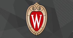 The UW–Madison crest over a dark grey background