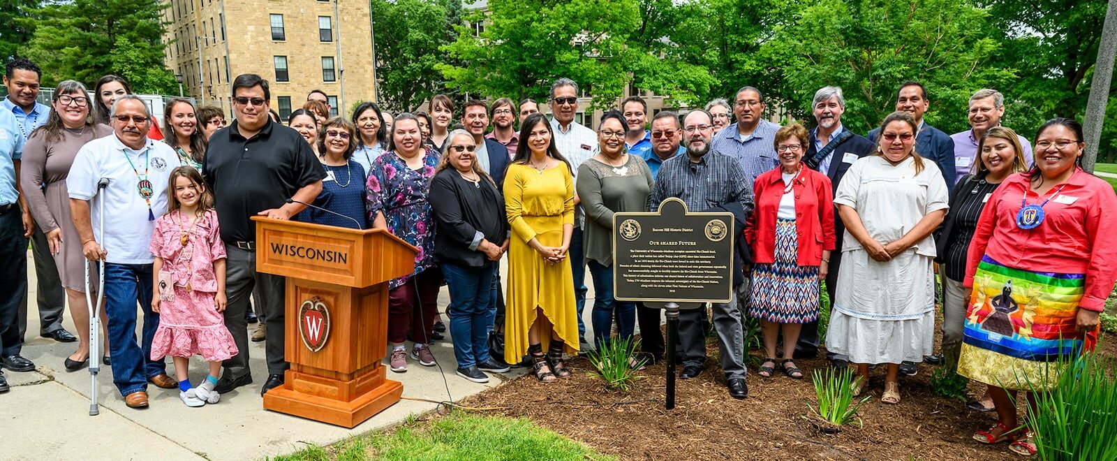 Members of the Ho-Chunk Nation are pictured during a heritage marker dedication ceremony for the "Our Shared Future" plaque on Bascom Hill.