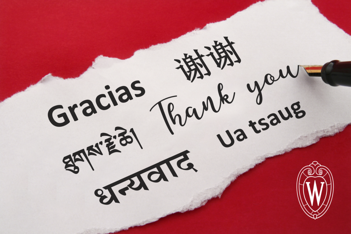 An illustration of a piece of scrap paper and a fountain pen with "thank you" written on the paper in Spanish, Chinese, Tibetan, English, Nepali, and Hmong. The UW crest appears in the bottom right corner.