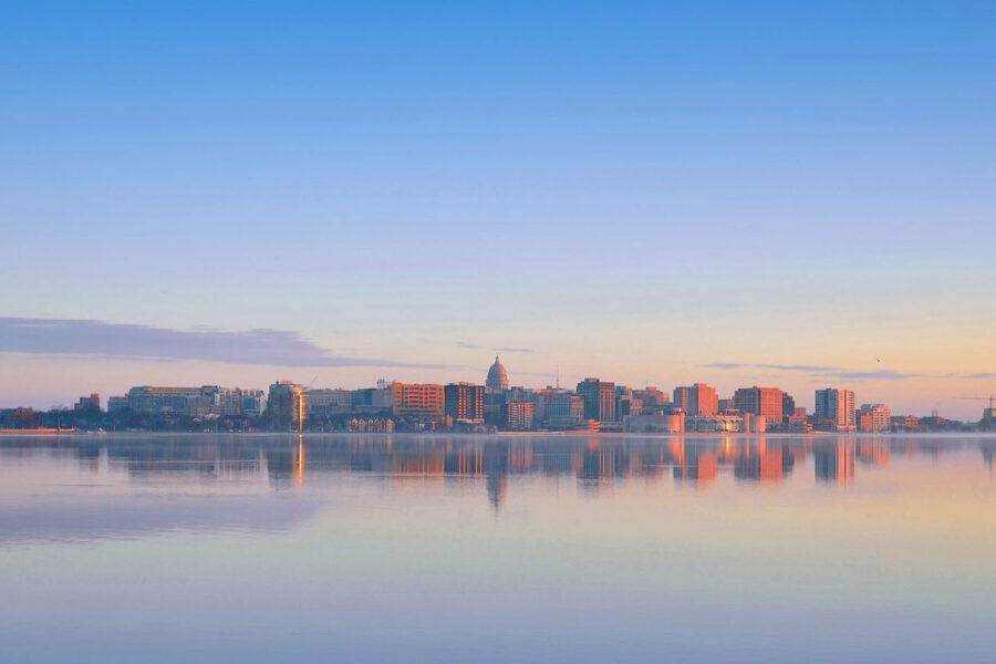 Landscape photo of the Madison skyline on the isthmus as seen from Lake Monona.