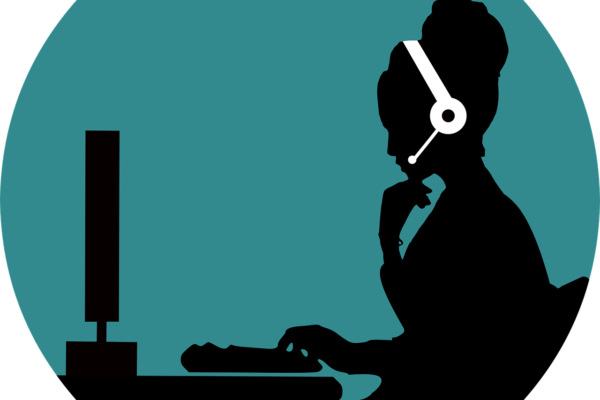 Illustration of a silhouetted person sitting at a desk using a computer with a headset on their head.