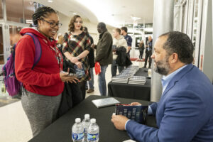 Ben Jealous speaks with student while signing book